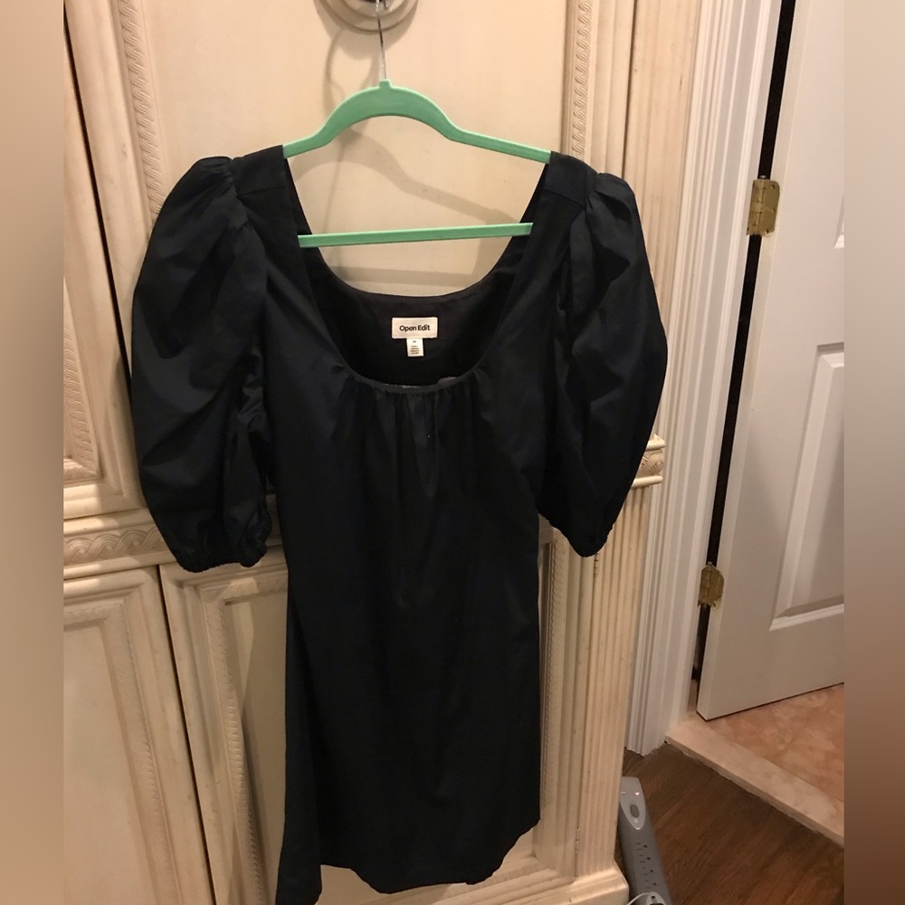 A black short sleeve open back summertime cute dress